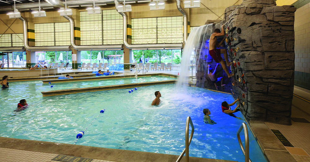 The waterfall and climbing wall in the pool area.