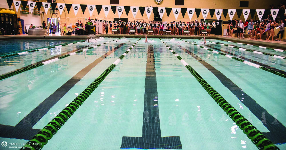 Students use the lap pool during a swim meet.