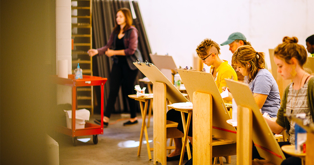 Students working at easels