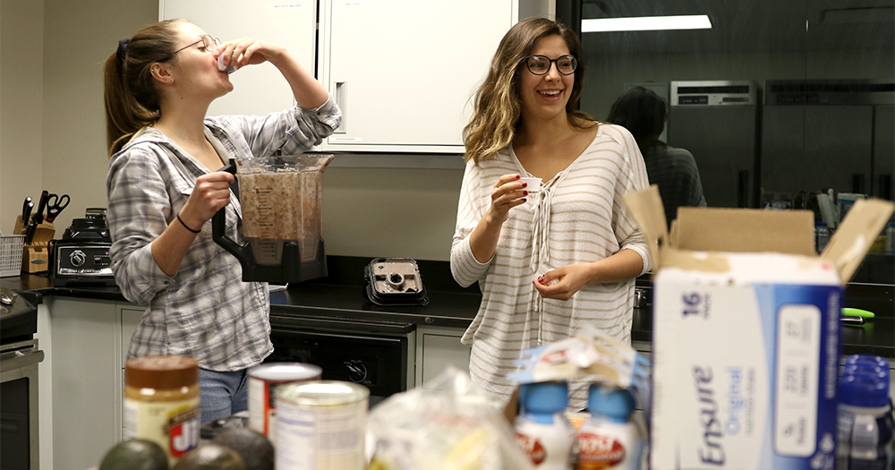 students taste test their smoothie creations.