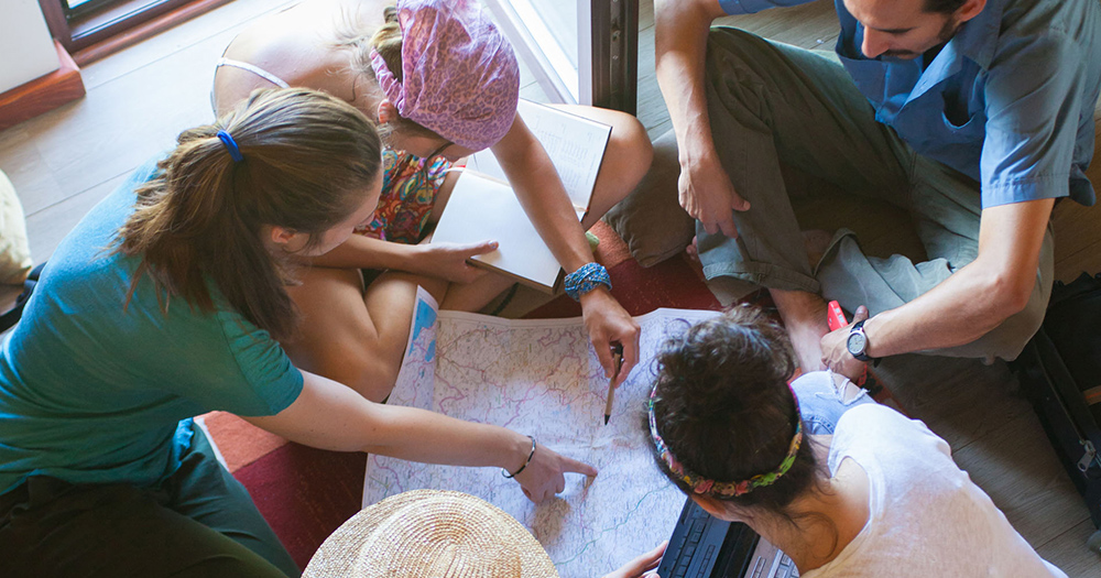 students looking at a large map