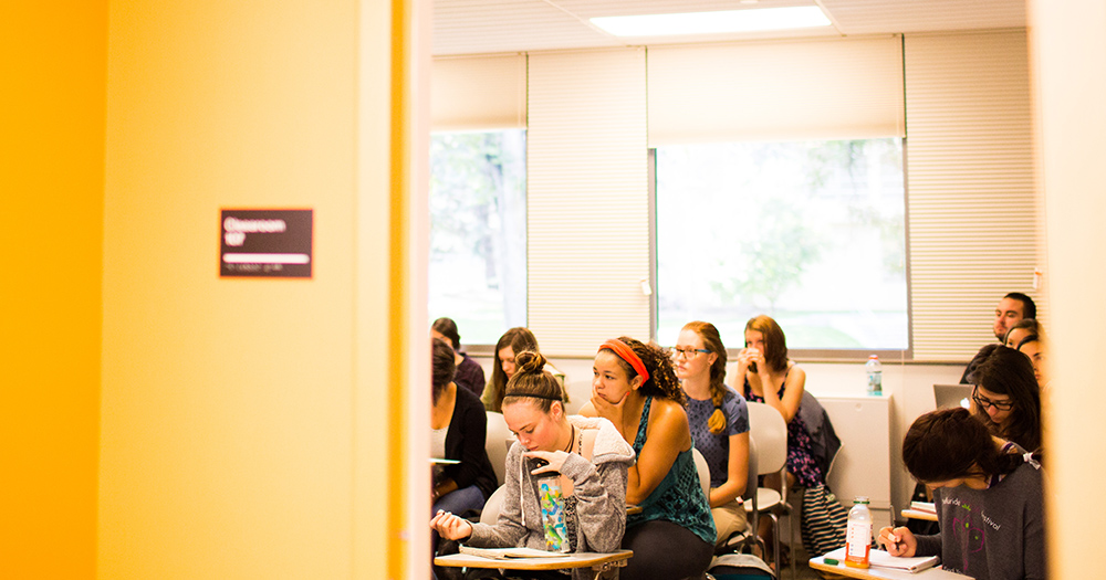 students listen intently inside a classroom