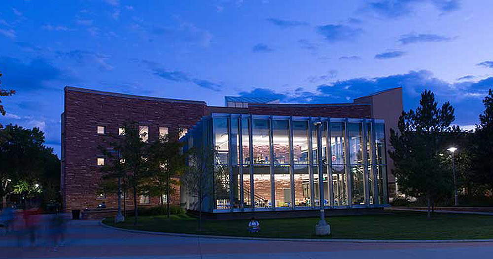 The study cube lit up at night.
