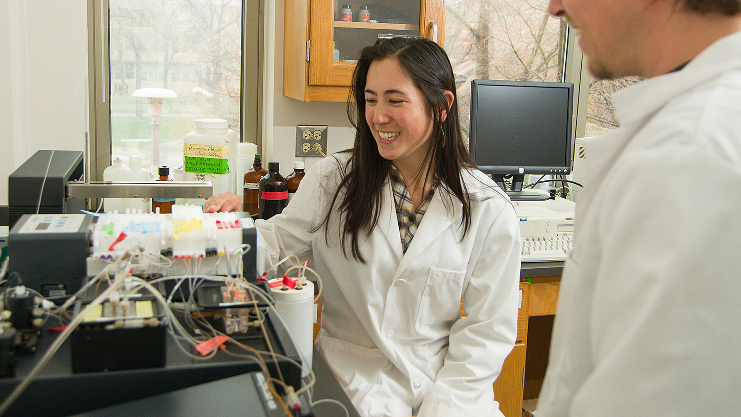 students test samples in a lab