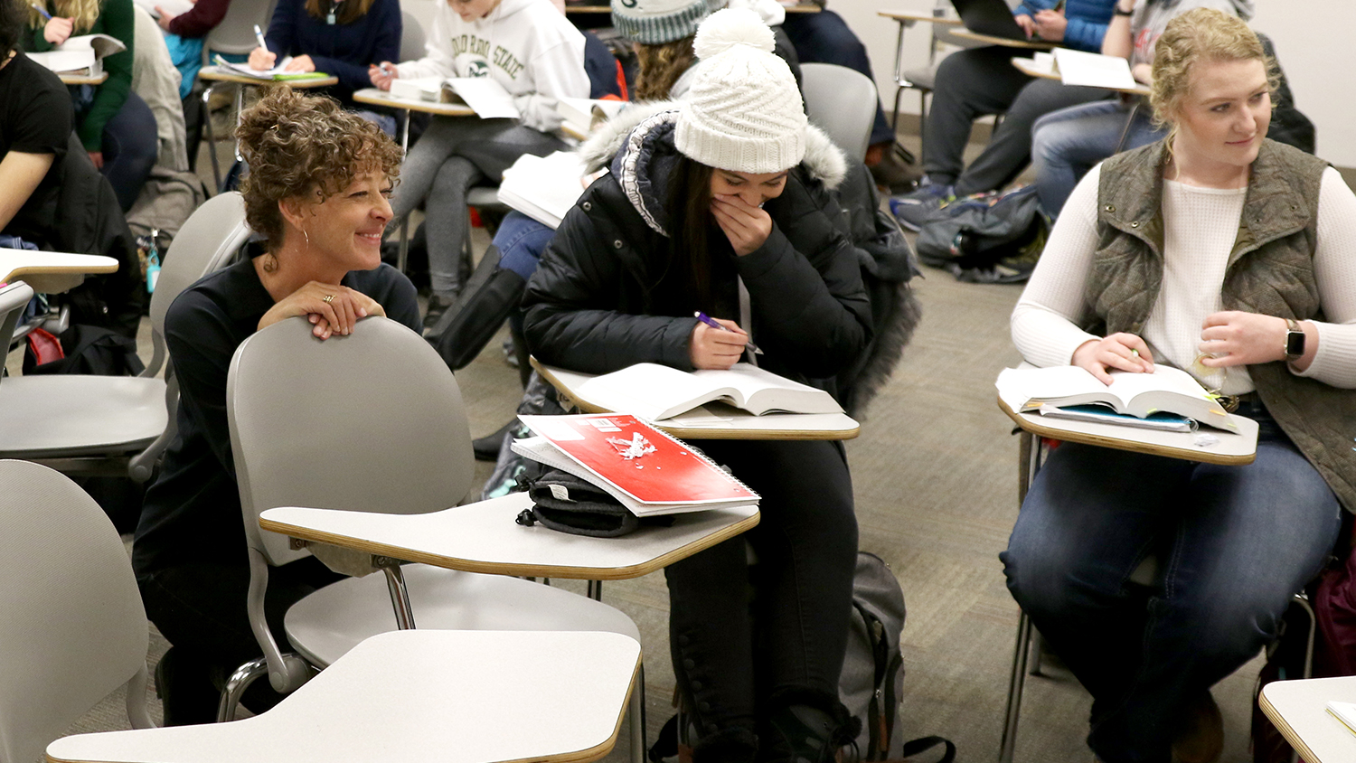 A csu english professor engages with students in a writing group