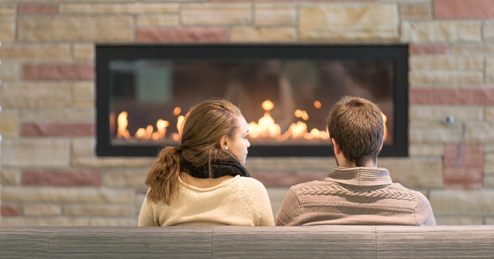 People in front of a fireplace