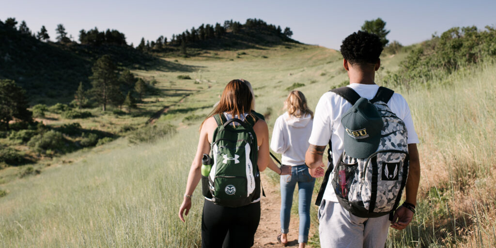 Students hiking dirt trail