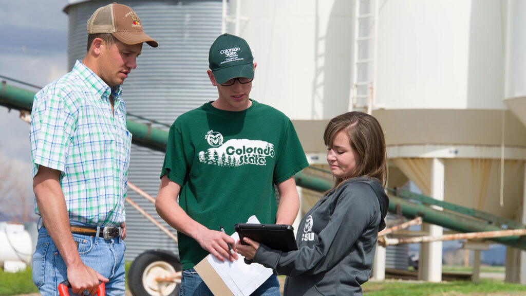 Students compare notes at the agricultural research center.