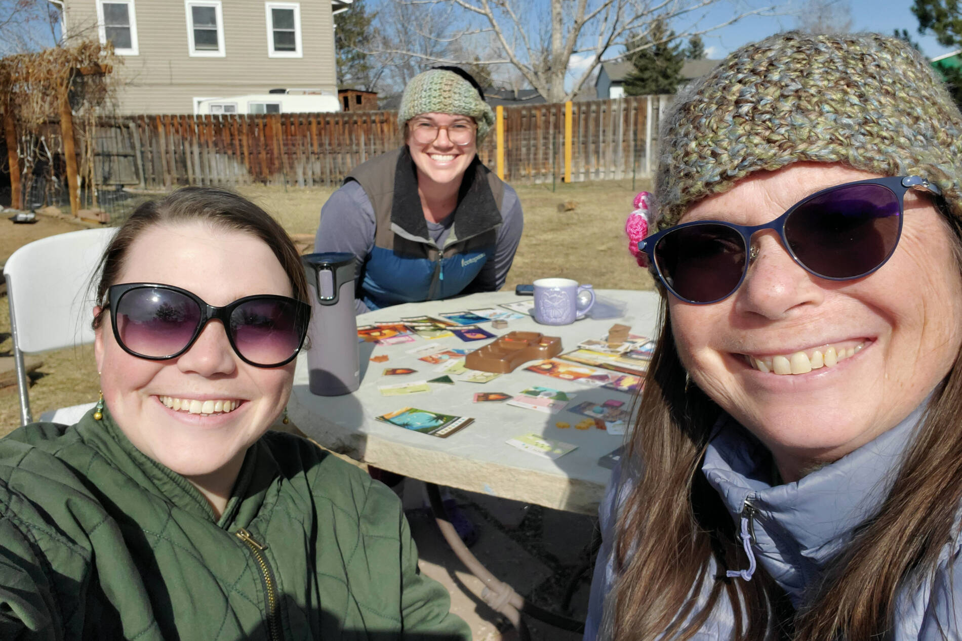Playing a board game with older sister and mother
