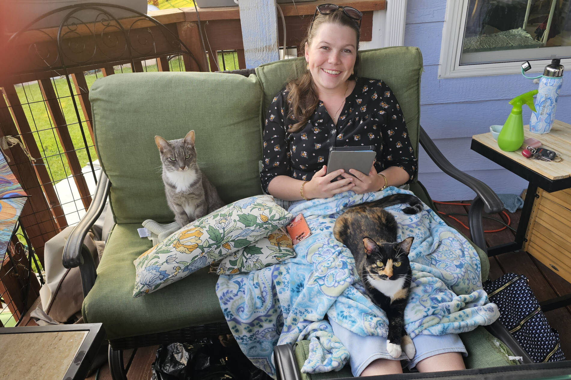 Reading outside with two cats, Matylda and Isabel