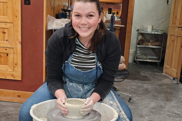 Juliette throwing pottery