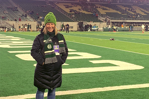 Heather standing on the CSU football field