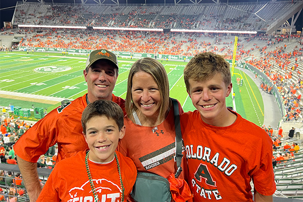 Heather with her family at a CSU football game