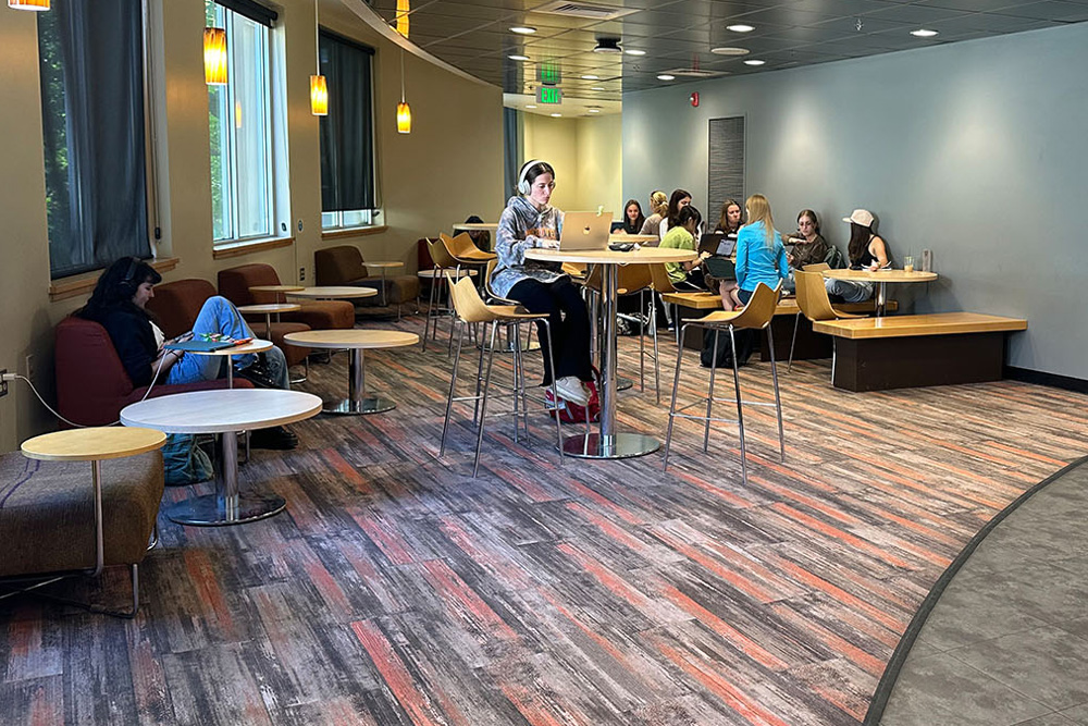 Students sitting at Morgan's Grind Cafe in the Morgan Library