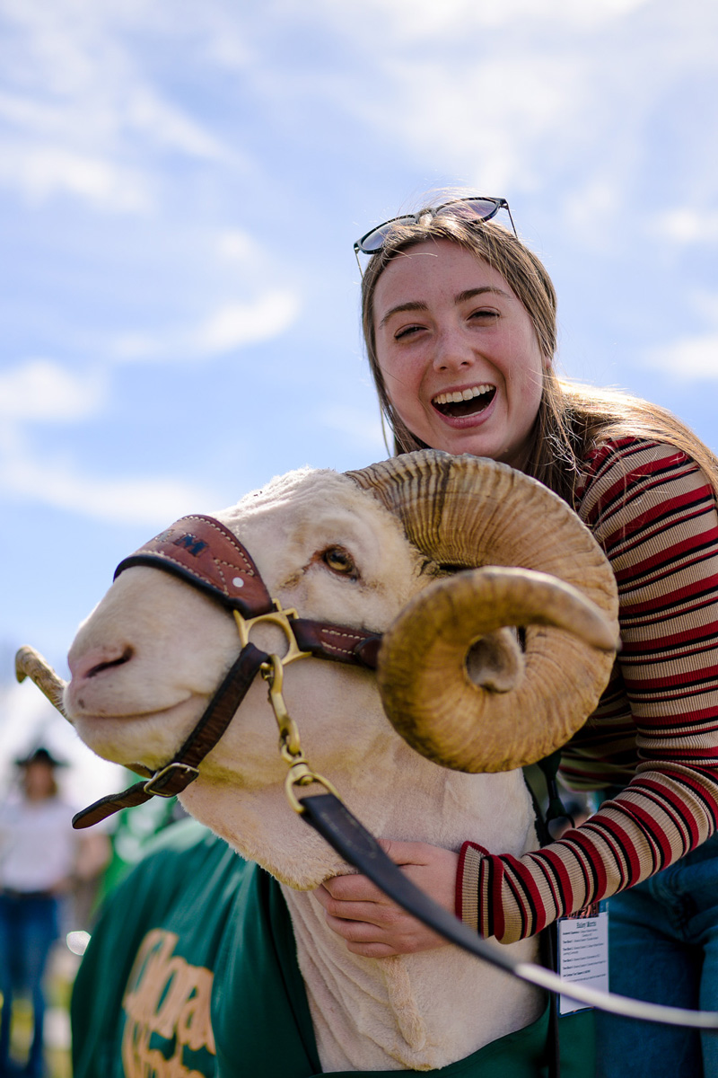 CAM the Ram poses with an excited student