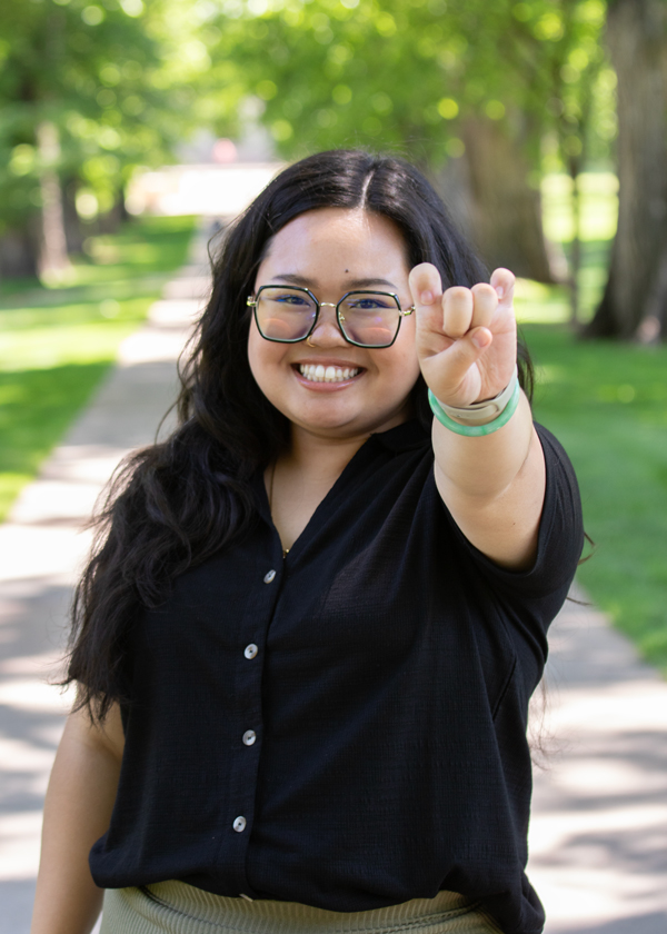 Cindy holding up Ram horn hand sign