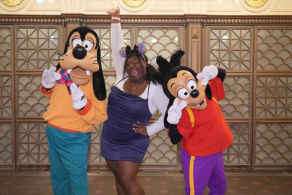 Alexis with Goofy and Mickey at Disney