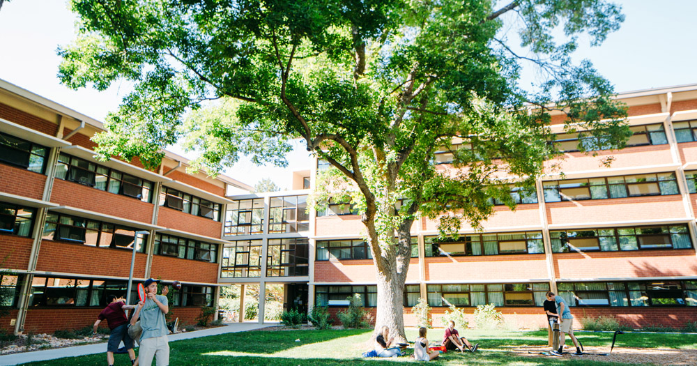 Students relax outside of their residence halls on the CSU campus.