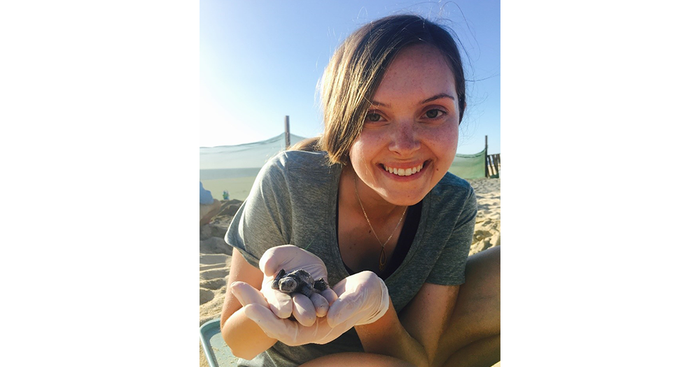Hannah holding a baby sea turtles