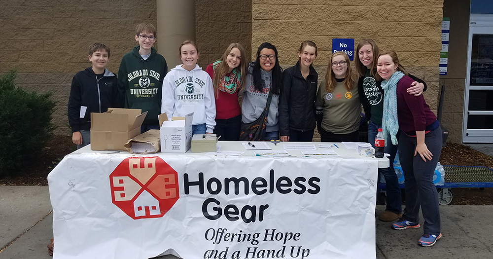 CSU scholars pose after doing volunteer work for a homeless organization.