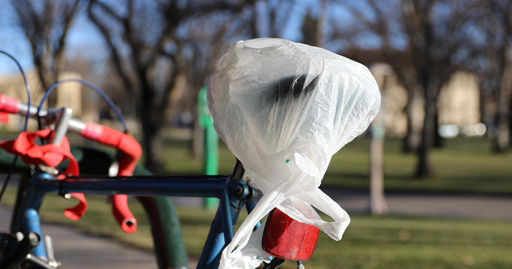 Tie a plastic bag over your bike seat to avoid it getting wet.
