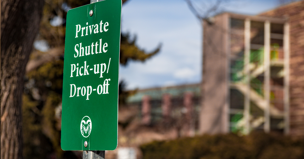 A private shuttle stop near Allison Hall on campus.