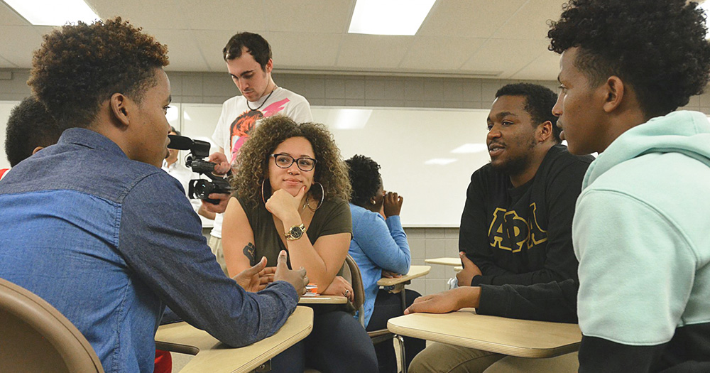 Students have a lively discussion in an ethnic studies class