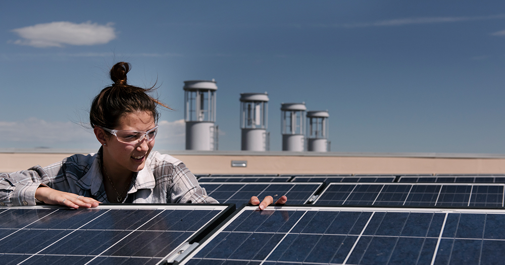 an engineering student works on solar power panels