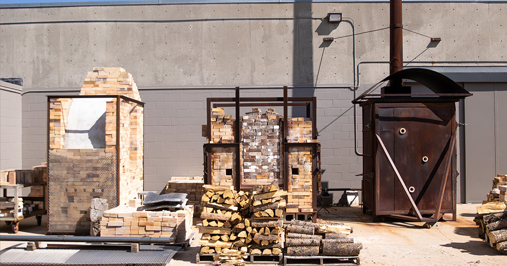 The gas and woodburning pottery kilns at colorado state sit outside the pottery studio