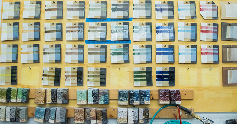 The glaze test tile wall gives students an idea of how glaze chemicals combine to create colors.