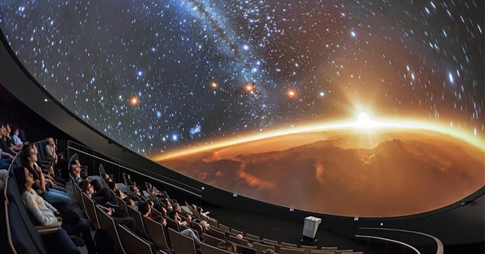 Museum visitors look up at a magnificent display of celestial imagery on the OtterBox Dome theatre at the Fort Collins museum of discovery.