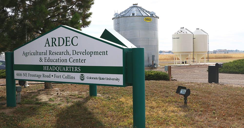 ARDEC sign in front of facility and silos