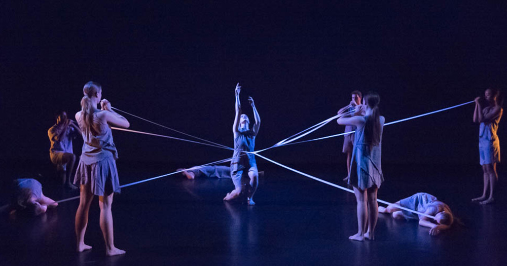 Dance students perform an interpretive, dramatic dance with ribbons