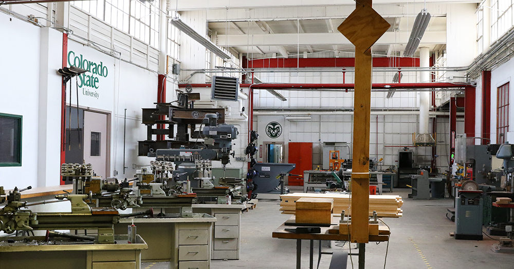 A wide view of an airy, high-ceilinged construction lab with multiple tools and machines