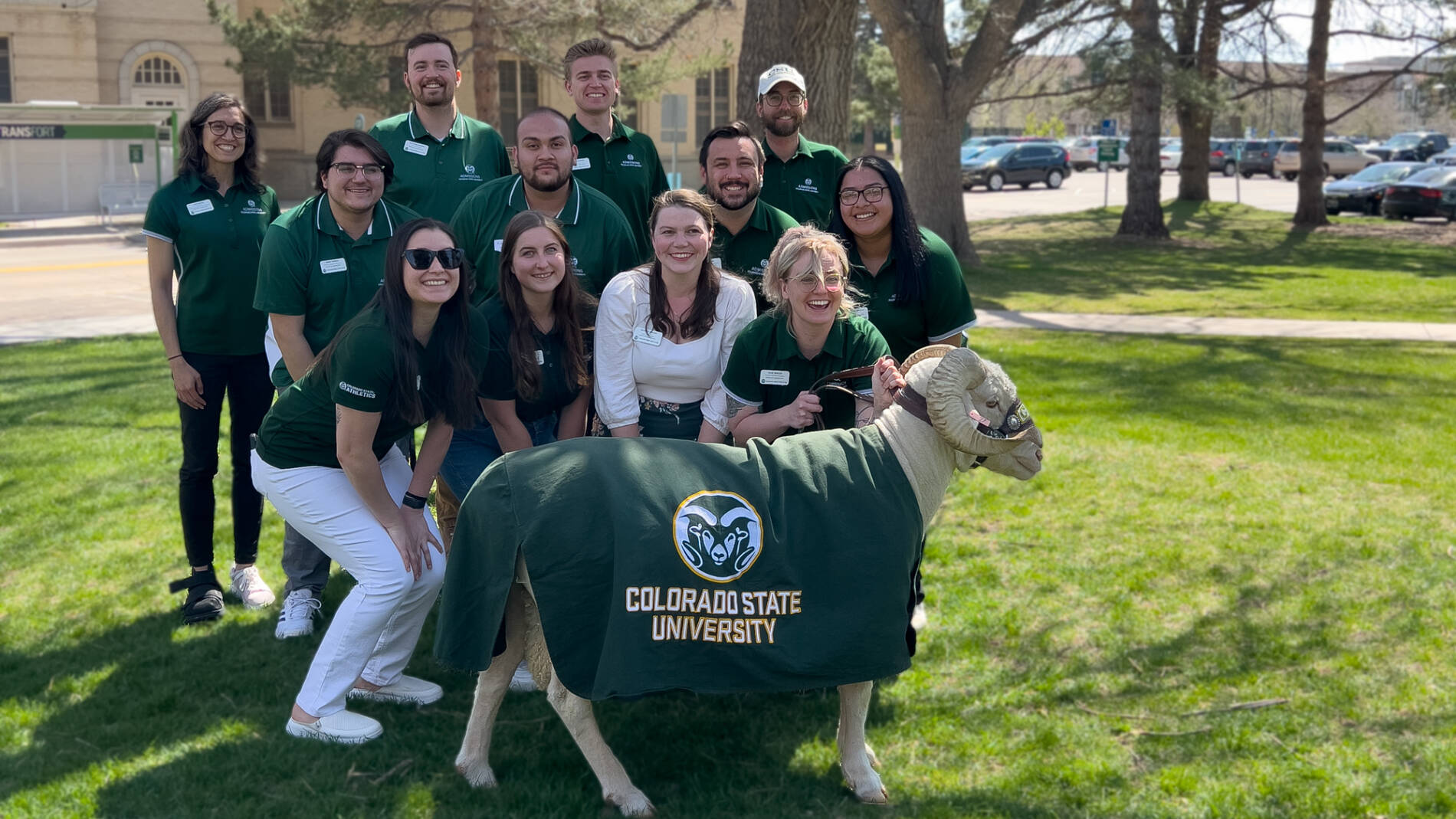 Group of admissions counselors outside with CAM the Ram