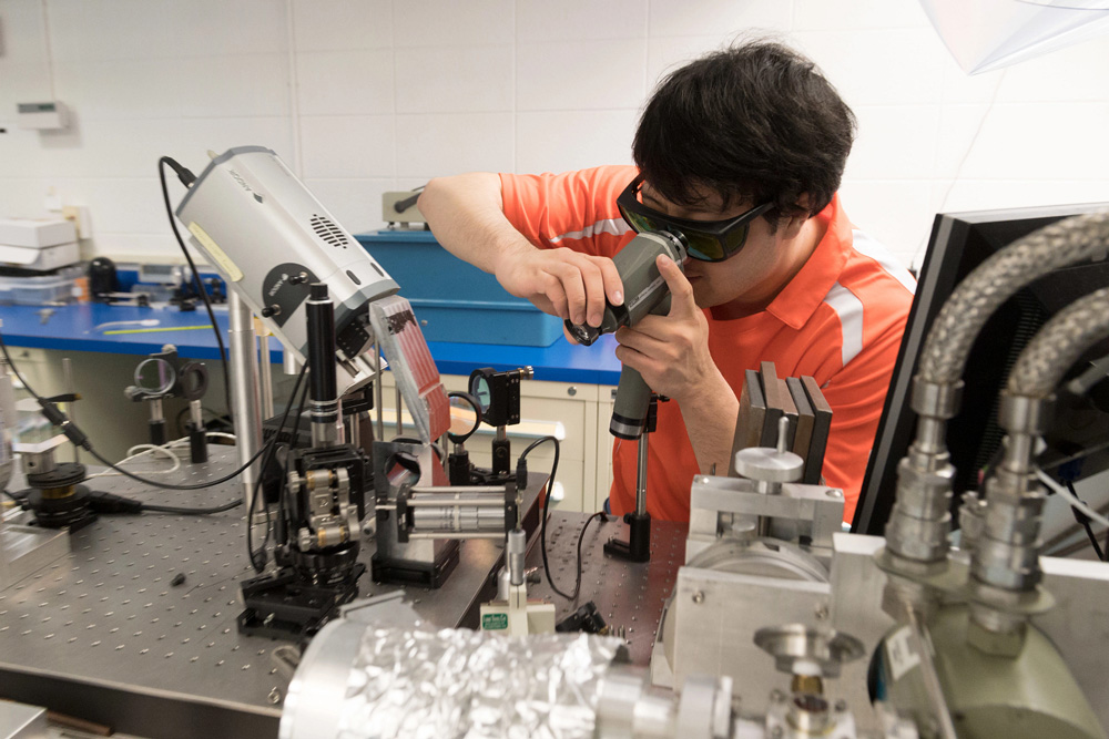 An engineering student uses the Laboratory for Advanced Lasers and Extreme Photonics