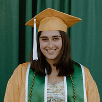 Headshot of Anais Markwood in graduation cap and gown