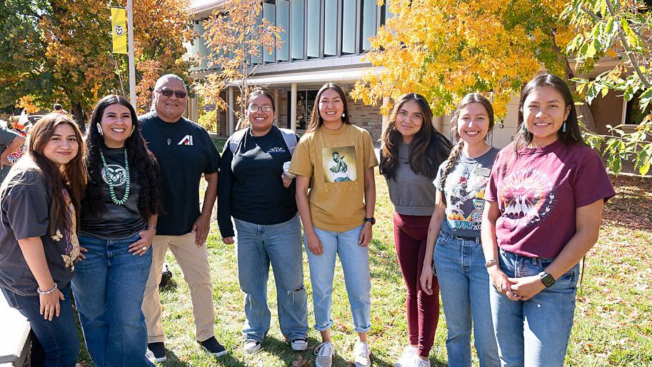 Native American students stand in a line for a group photo